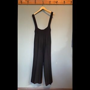 High wasted wide leg pants with over the shoulder button straps.